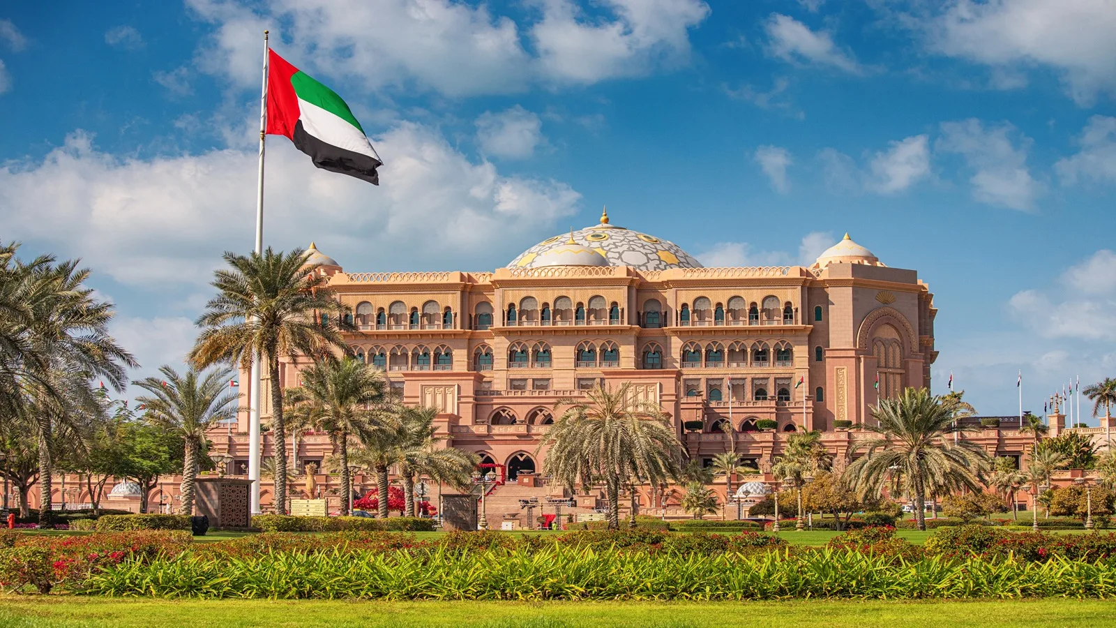 Emirates Palace Hotel Abu Dhabi with grand golden architecture and landscaped gardens