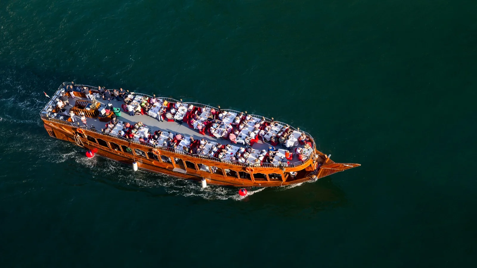 Traditional dhow boat cruising along the waters of Abu Dhabi