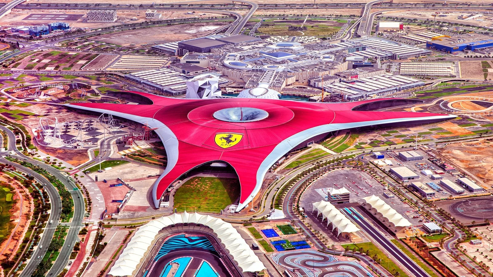 Ferrari World Abu Dhabi with its iconic red roof on Yas Island during the Abu Dhabi Full Day City Tour