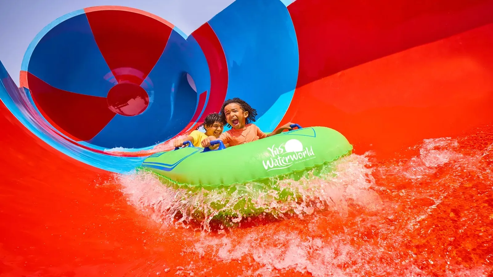Visitors enjoying an exciting water slide ride at Yas Waterworld Abu Dhabi on Yas Island