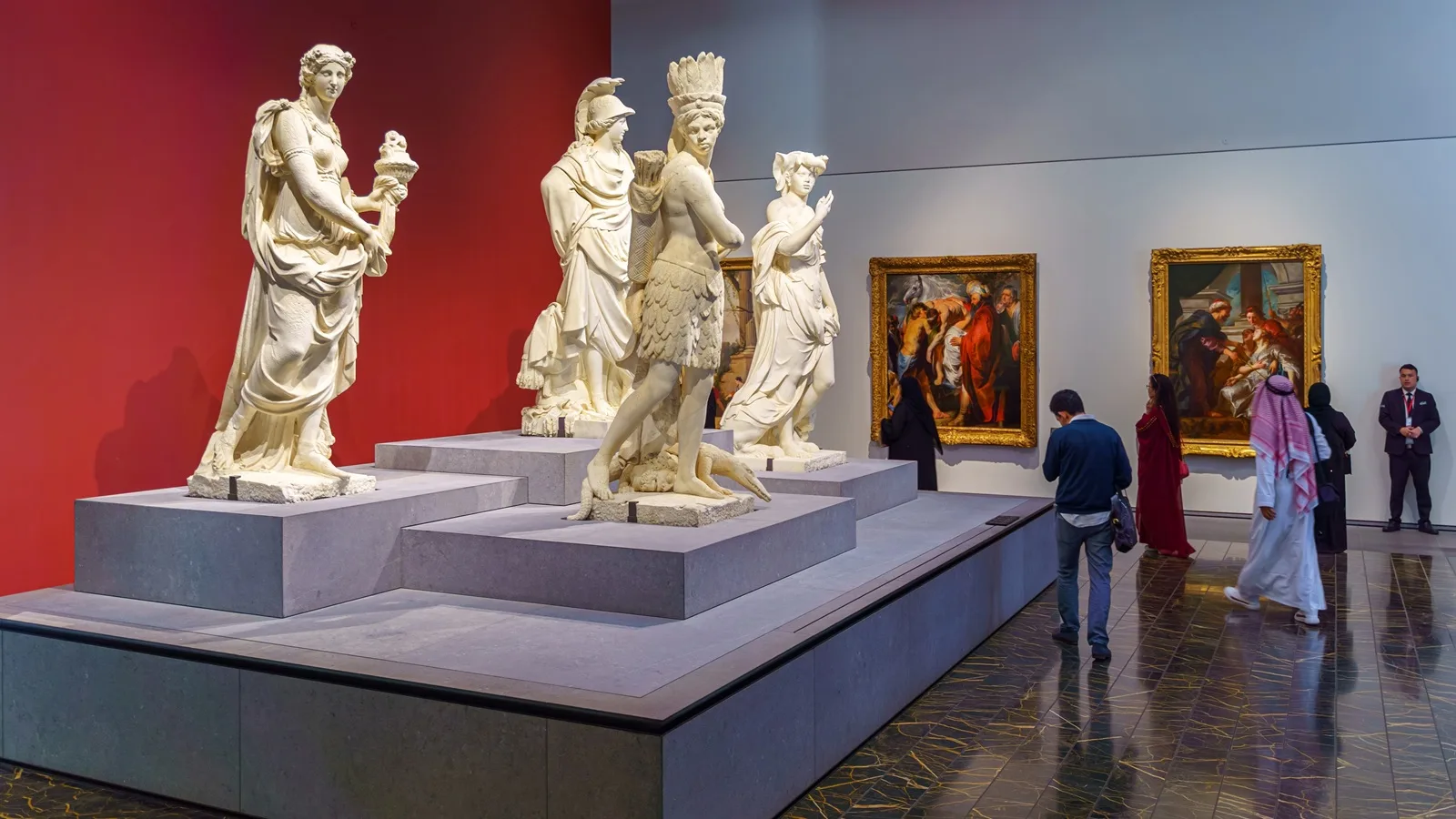 Historic statues and sculptures displayed inside the galleries of Louvre Abu Dhabi