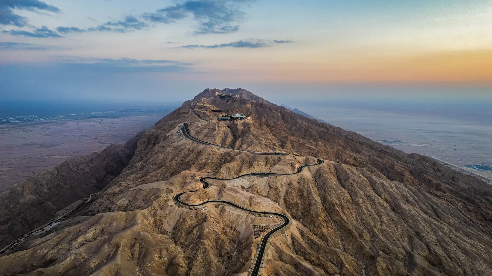 Jebel Hafeet mountain overlooking the desert landscape of Al Ain during the Al Ain Oasis Tour